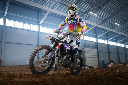 Latvia, Riga August 27, 2025,  regular training Motocross Rider on Dirt Track in Indoor Arena