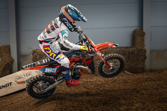 Latvia, Riga August 27, 2025,  regular training Motocross Rider Mid-Air Trick on Dirt Track