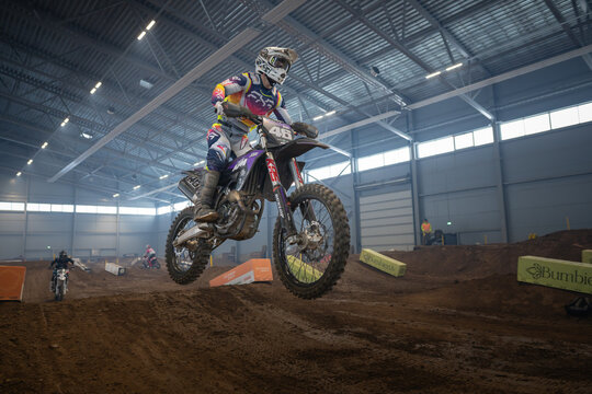 Latvia, Riga August 27, 2025,  regular training Motocross Rider Mid-Air Stunt in Indoor Arena