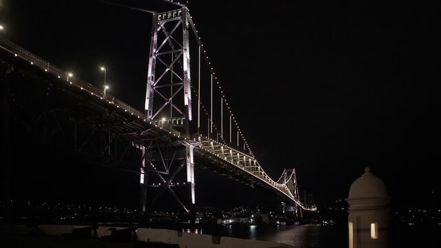 Florianopolis, night view of the Herc&iacute;lio Luz suspension bridge with the Santana fort in the foreground.