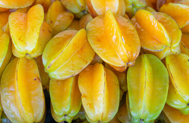 close up on fresh starfruit carambola stacking in the market