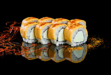 Fresh mouth-watering sushi with salmon and mango philadelphia cheese prepared in a Japanese restaurant. © sergo321