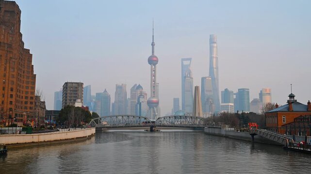 Shanghai city skyline and Oriental Pearl Tower in Lujiazui district with urban traffic and New Year atmosphere, China