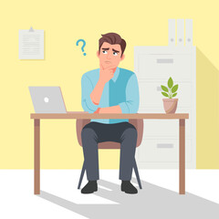 Man Sitting at Desk with Laptop.