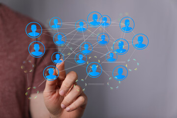 Fototapeta premium Hand interacting with digital network connections. Represents teamwork, collaboration, and social concepts.