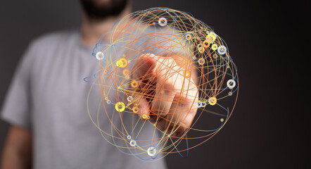 Abstract image of a hand touching a global network. Represents communication, technology, and...