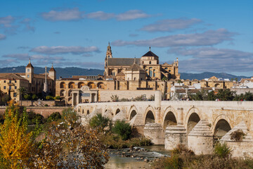 Fototapeta premium Historic Roman Bridge and Mosque-Cathedral (Mezquita) at Sunset, Cordoba, Spain