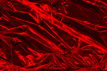 Vector red foil texture background. Abstract gradient bright and shiny light reflection rough texture surface. Vector illustration for background, backdrop, web, wallpaper, print and design artwork.