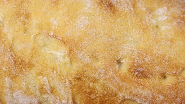 White wheat sourdough Ciabatta bread crust texture circle rotation close up