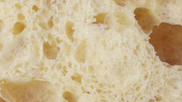 Soft crumb of white wheat sourdough Ciabatta bread texture circle rotation close up