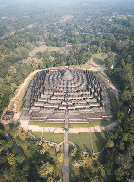 Aerial view of the ancient Borobudur Temple rises majestically from the lush green landscape, a testament to the rich history, Java, Java, Indonesia.
