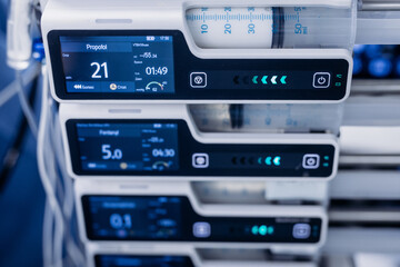 Modern hospital medication delivery system featuring advanced infusion pumps with digital displays...