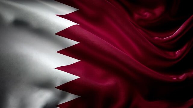 qatari flag waving in the wind. flag of qatar