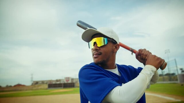 Focused baseball batter prepares for a powerful swing