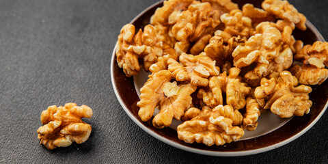 Obraz premium Walnut kernels peeled dried walnuts tasty snack fresh delicious gourmet food background on the table rustic food top view copy space keto and paleo diet vegetarian and vegan food