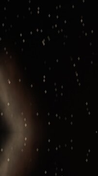 Abstract dark background with shimmering particles and a subtle, flowing light streak, creating a mysterious and dynamic visual effect.