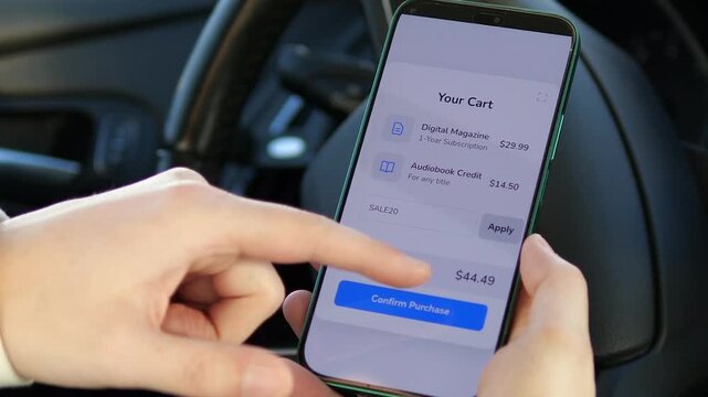 Close-up of a customer applying a discount code on a mobile shopping app. High-quality footage showcasing a seamless digital checkout process for magazines and audiobooks. Perfect for e-commerce