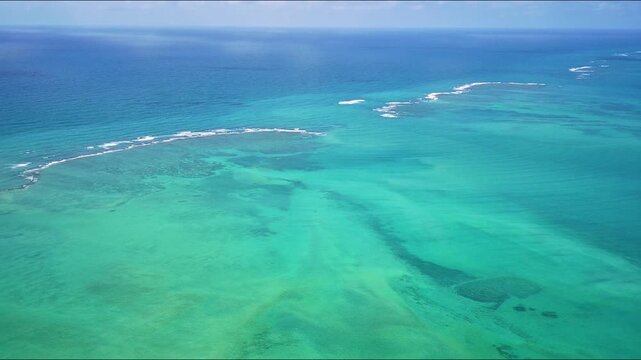 Aerial view of coral reef barrier at northeastern Brazil in Alagoas.