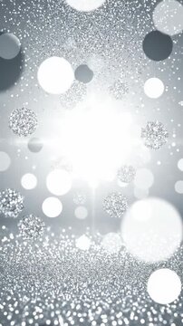 Luxurious silver shimmer background with falling glitter particles and bright bokeh lights, perfect for holiday intros or luxury event backgrounds. Vertical. Video. Portrait Orientation.