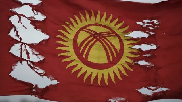 Tattered Kyrgyz Flag Waving in the Wind with Rips and Holes