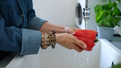 Woman Washing Red Pepper