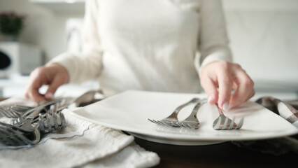 Clean Dishes And Forks Are Lying On The Table