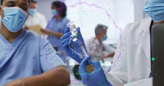 Medical clinician hands drawing dose from vial after insertion while network pulsing around hands