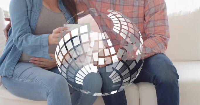 Expecting couple sitting sofa, woman bringing sonogram forward for prenatal check, mosaic obscuring