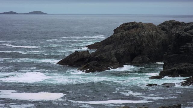 Powerful Atlantic Waves Crashing Against Rocky Cliffs at Malin Head, Donegal, Ireland