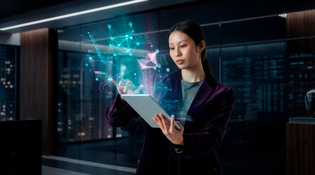 Technology analyst woman using tablet with holographic data interface in modern office