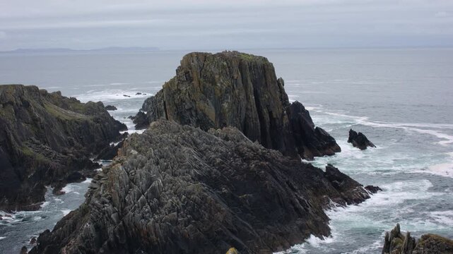 Dramatic Jagged Cliffs and Sea Stacks Along the Wild Atlantic Coast at Malin Head, County Donegal, Ireland