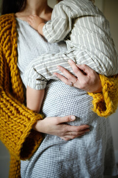 Pregnant Mother holding Toddler
