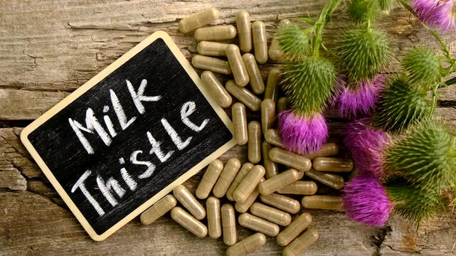 Milk thistle supplements in nature. Selective focus.