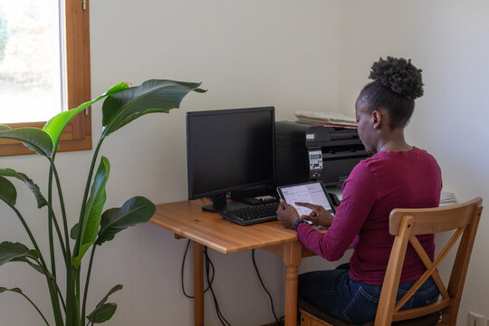 email checking, woman reading e-mail at home on digital tablet