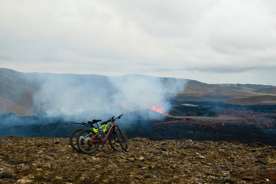 Mountain Bikes Overlooking Smoking Volcanic Landscape