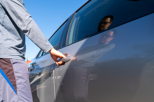 Man opening car door 