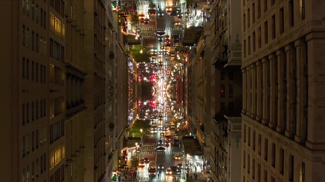 Kaleidoscopic high angle of New York City traffic at night creating mesmerizing mirror effect of urban life, lights, and endless movement in bustling metropolis