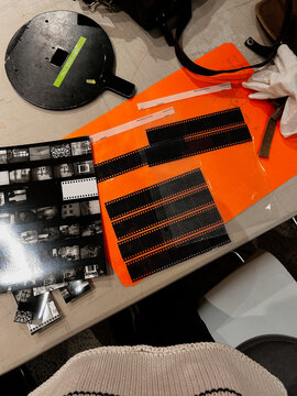 Film Negatives and Prints Organized on a Work Table for Review