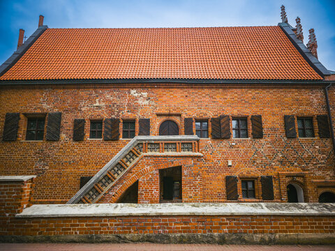 Side view of Perkunas House historic brick building in Kaunas Old Town Lithuania &ndash; August 17, 2025