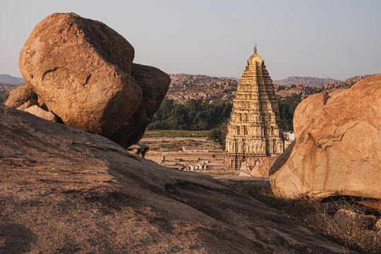 A historical stupa surrounded by rocks. 