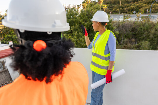 two fellow architects on a construction site