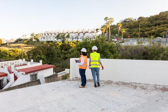 two fellow architects on a construction site