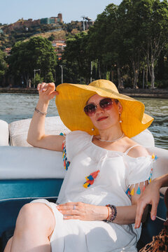 Family enjoys a boat ride on the river during holiday trip in summer