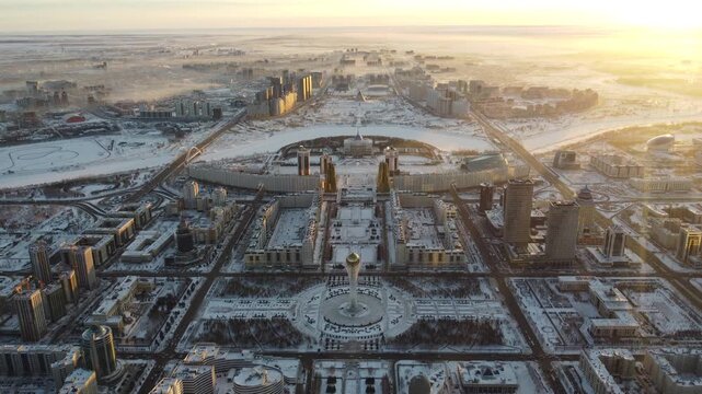 Drone flight above Astana city center with skyscrapers and Baiterek Tower. Capital of Kazakhstan, Qazaqstan