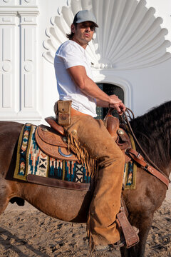 Cowboy Sitting On Mustang In Front Of White Church