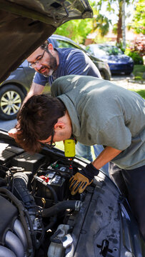 Father and Son Fixing a Car