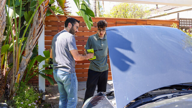 Father and Son Fixing a Car