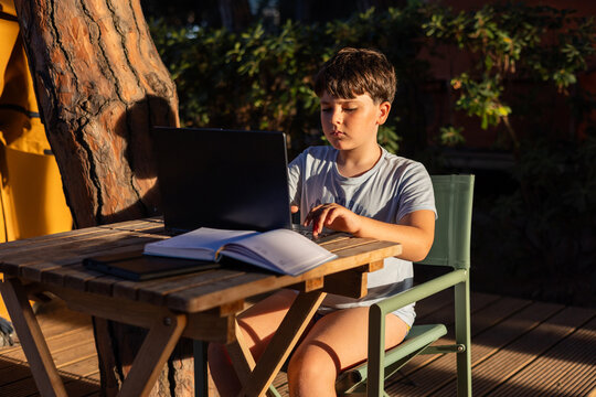 Image of a child with their laptop