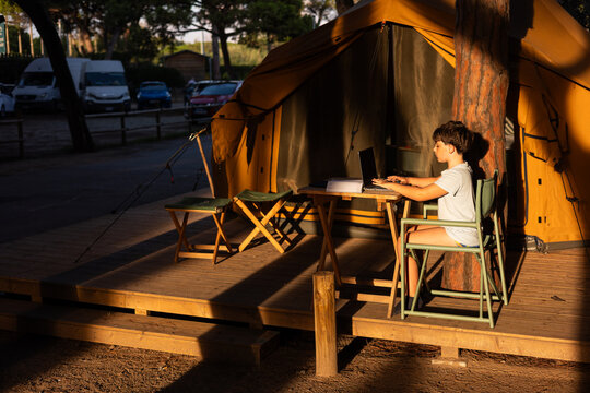 Image of a child with their laptop