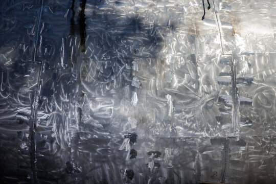 The surface of a sanded exterior wall of a ship